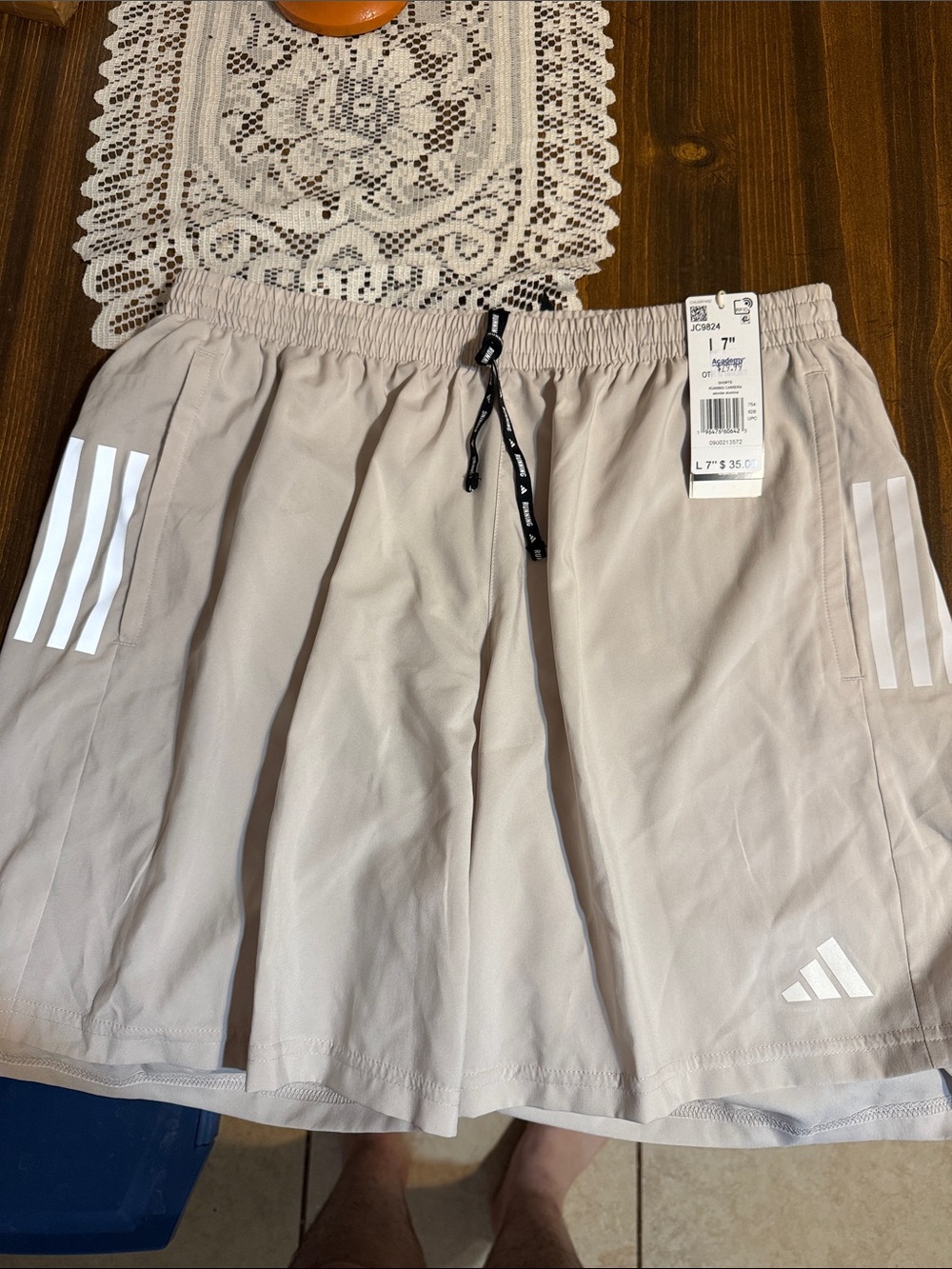 adidas Men’s Beige Athletic Shorts with White Stripe Accents